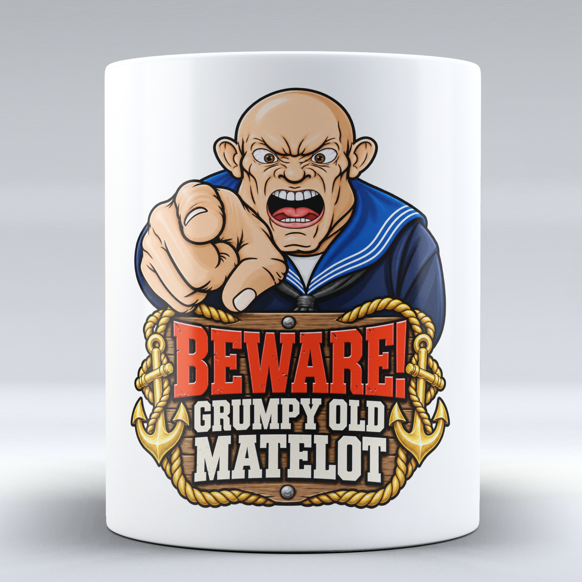 White ceramic mug featuring a pointing cartoon sailor, gold rope and anchors with Beware! Grumpy Old Matelot wording